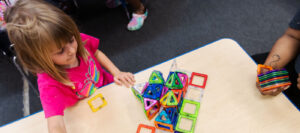Child plays with puzzle