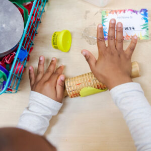 Child playing with clay.